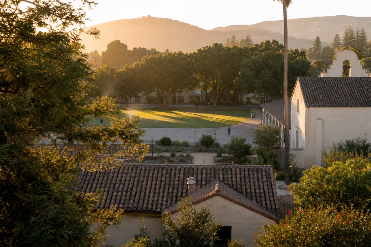Golden-hour view over Sonoma Plaza's historic square and surrounding rooftops, no text, no logos, no people