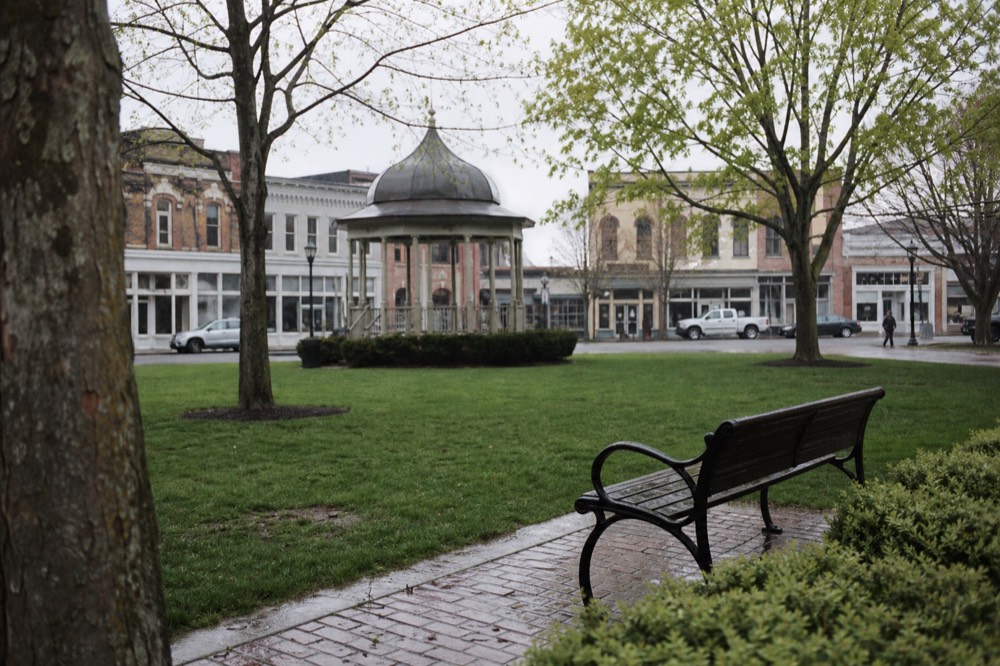 Historic buildings around Healdsburg plaza with the town green in the foreground, no text, no logos, no people